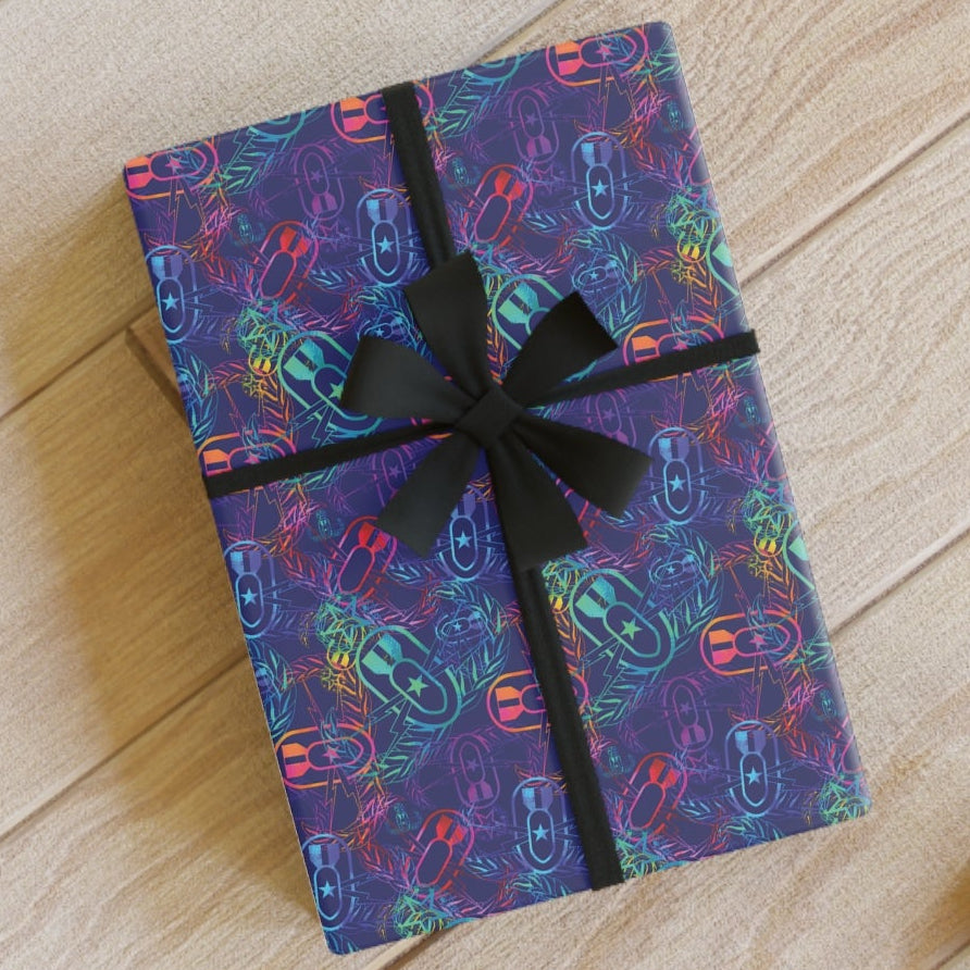Gift box with colorful pattern and black ribbon on a wooden floor