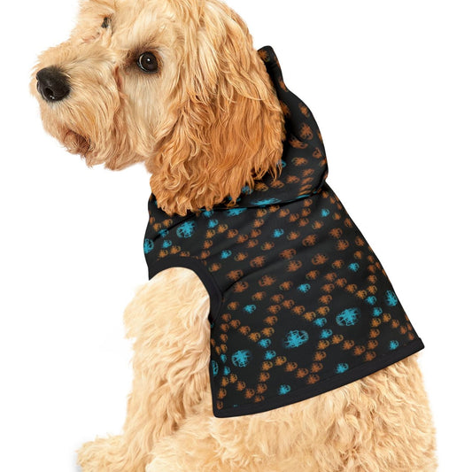 Dog wearing a black and blue patterned jacket on a white background