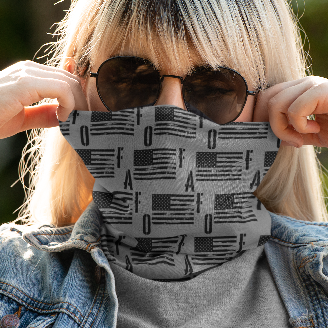 Person wearing a face mask with an American flag pattern outdoors