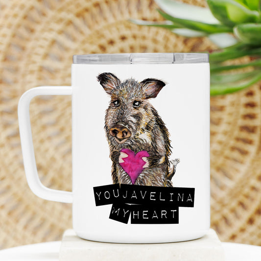 White mug with a design of a javelina holding a pink heart and text 'YOUJAVELINA MY HEART' on a woven background.