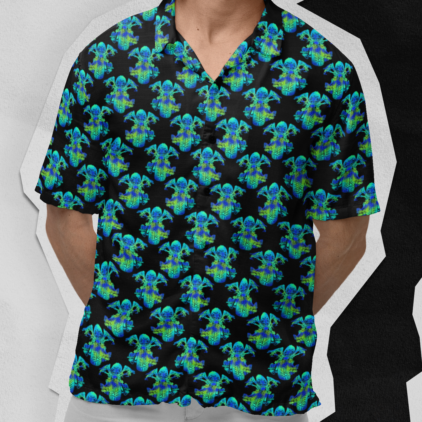 Man wearing a colorful patterned shirt and sunglasses against a white background